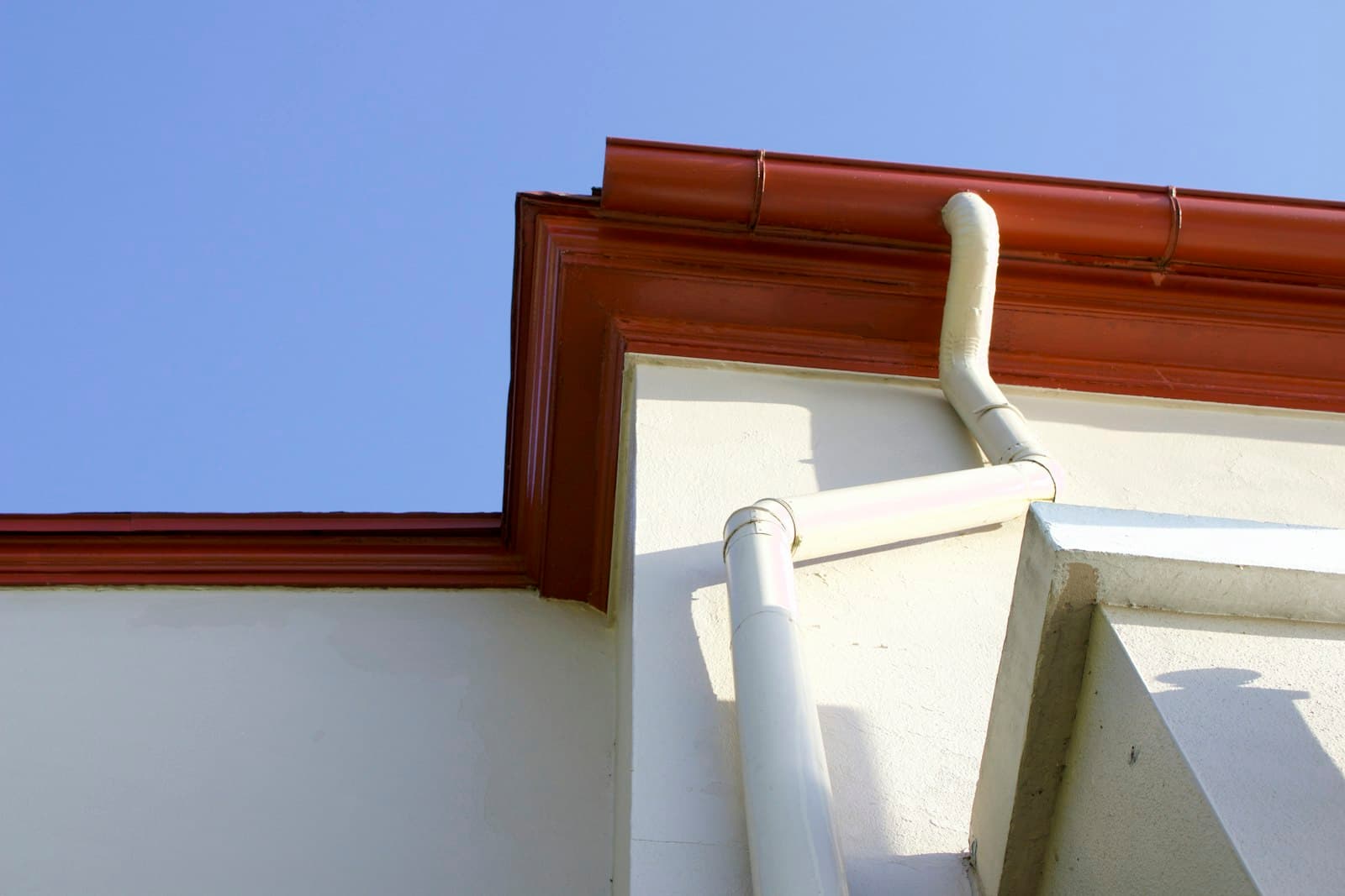 Gutter and downspout attached to a home