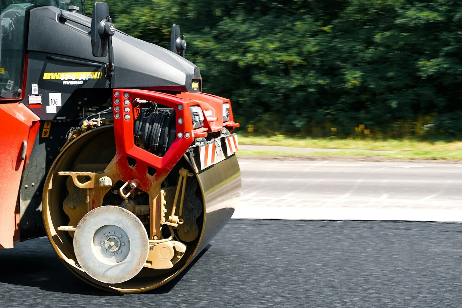 Road roller compacting freshly laid asphalt